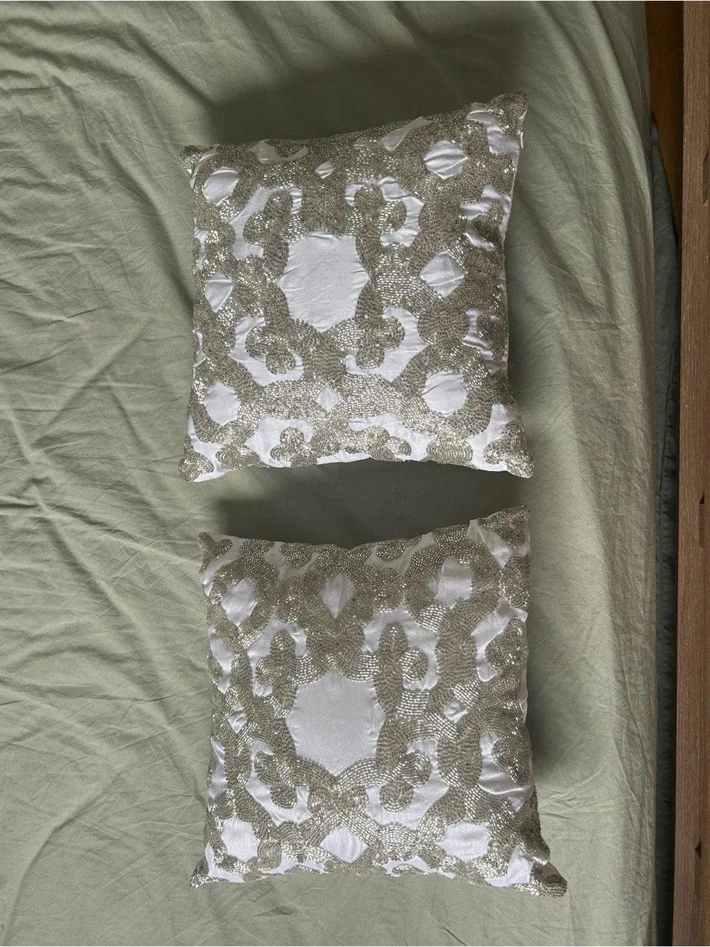 White Decorative Throw Pillow Pair with Beaded Silver Pattern